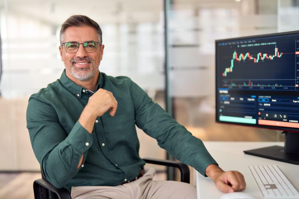 Are Gen X the New Risk-Takers? 5 Investment Approaches They Have Embraced Man looking at a stock chart