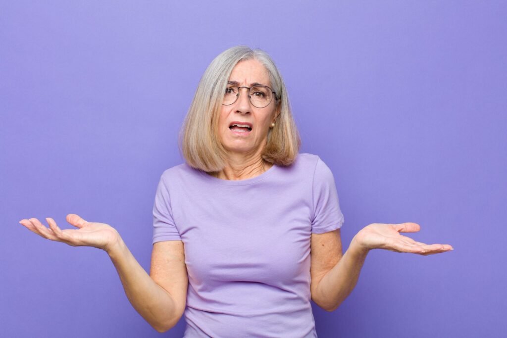 Confused senior shrugging