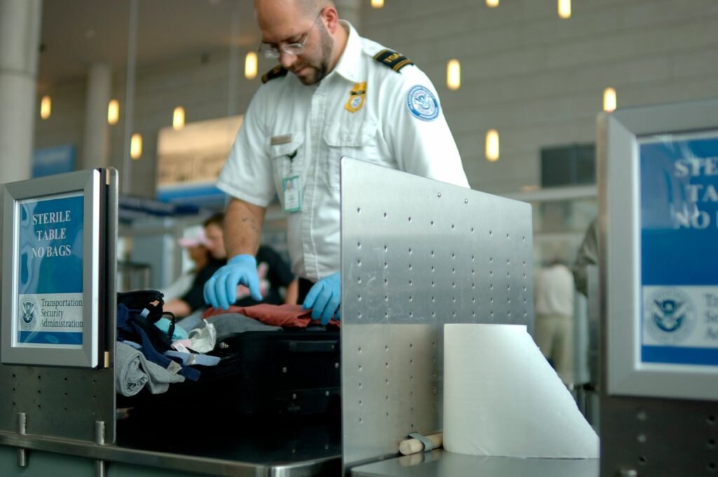 These 5 Common Items Could Get You Flagged by TSA This Holiday Season A TSA agent inspects carry-on bag luggage