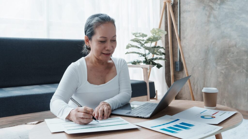 8 Ivy League Colleges That Offer Free Online Courses Mature businesswoman working with laptop, doing paperwork in an office workplace