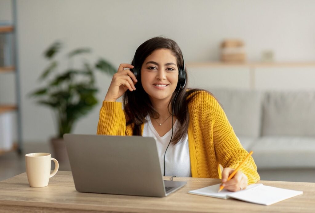 Woman working from home using headset.