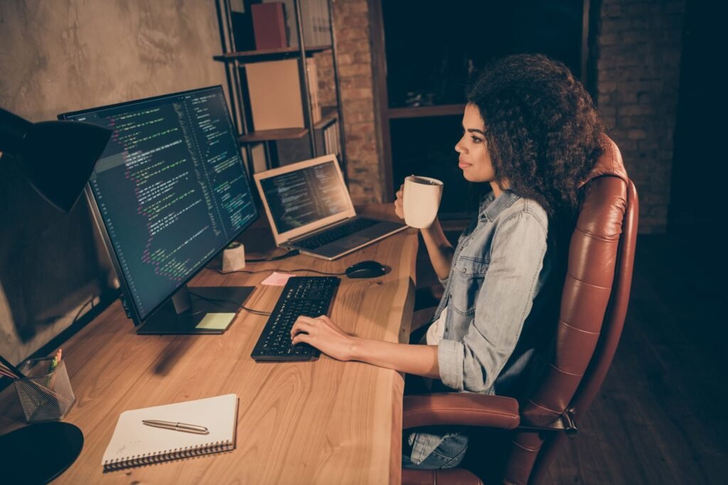 30 Legit Companies With Work-From-Home Jobs Software engineer working from home in the evening and drinking from a mug