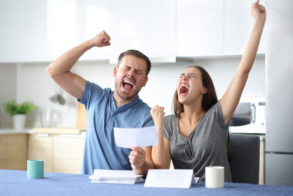 Happy couple after selling their home