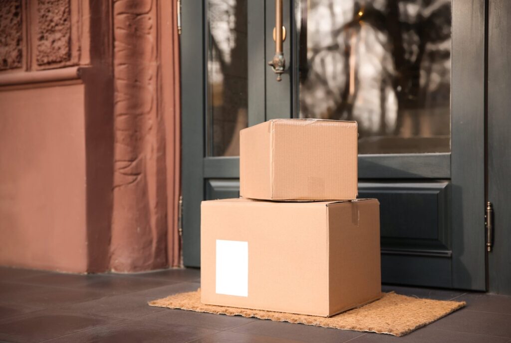 The Warehouse Pivot: How Your Online Shopping Is Changing the Retail Industry Packages at someone's front door.
