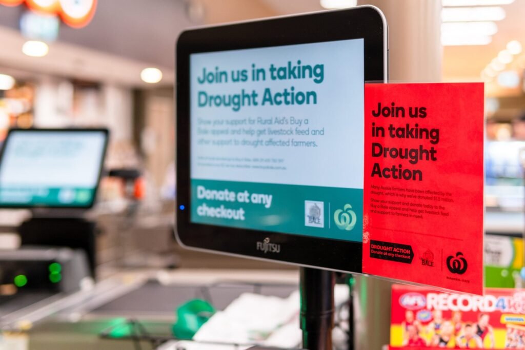 4 Reasons You Should Stop Donating Money in the Checkout Line Already Grocery store checkout counter asks shoppers for charity donations