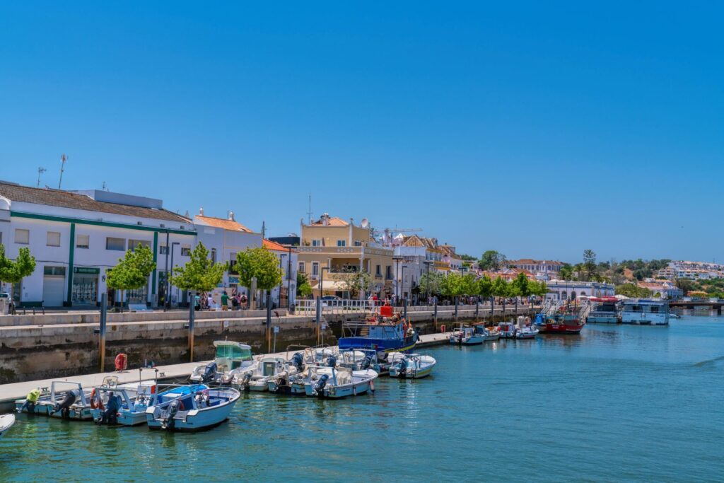 Gilao river Tavira with boats at the quayside, Tavira, The Algarve, Portugal
