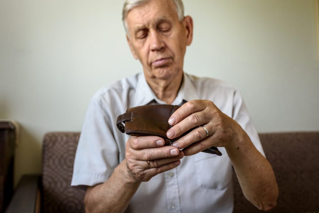 Broke senior opening empty wallet