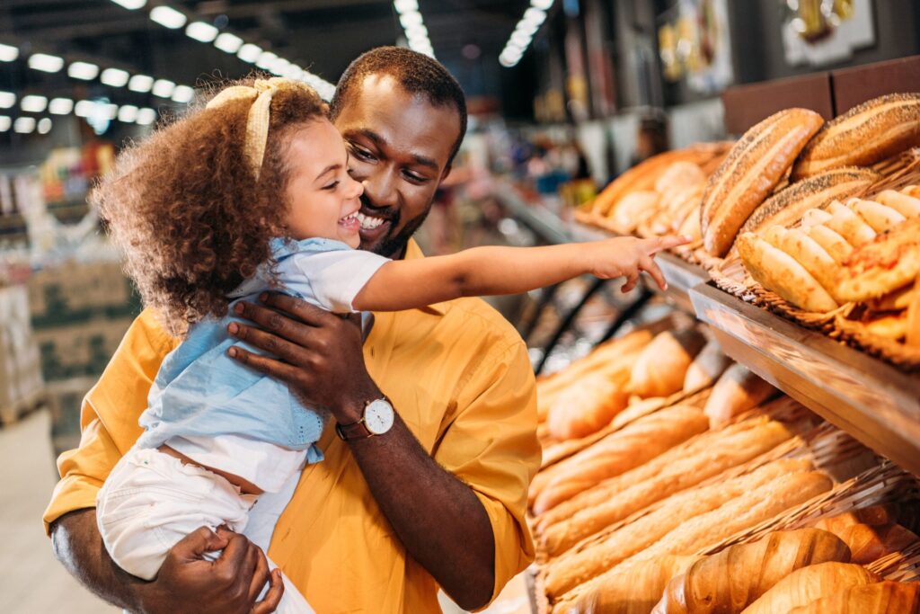 Father and daughter in the grocery store